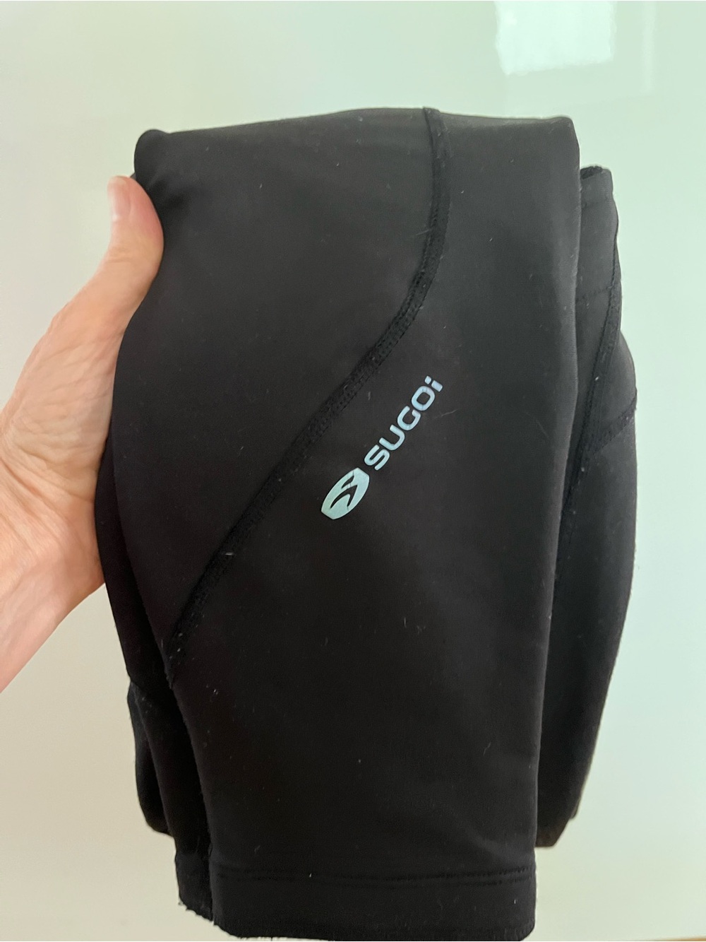 SUGOI Black Running Tights with reflective silver Logo